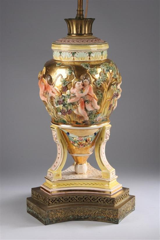 Appraisal: LARGE CAPO DI MONTE CERAMIC URN Tripod base gilt body