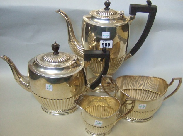 Appraisal: A silver four piece tea cum coffee set comprising a