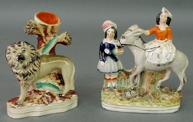 Appraisal: Staffordshire lion spill vase c and a figural group h