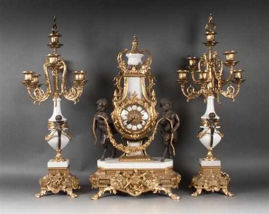 Appraisal: Louis XV style marble and porcelain three-piece clock garniture contemporary