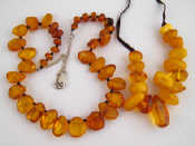 Appraisal: Two amber necklaces