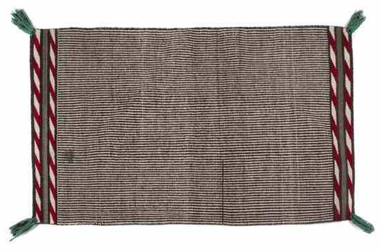 Appraisal: A Navajo Weaving twill woven saddle blanket with Germantown tassels