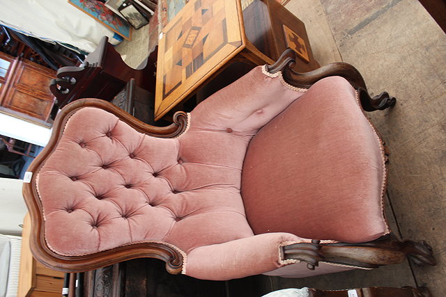 Appraisal: A VICTORIAN MAHOGANY FRAMED ARMCHAIR with pink draylon upholstery deep