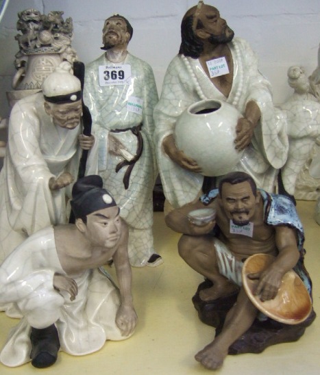 Appraisal: Four Chinese crackle-glaze figures th century depicting scholars sages and