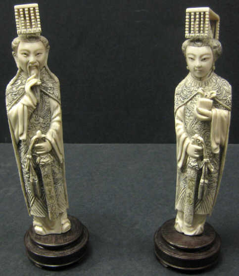 Appraisal: PAIR OF CHINESE IVORY ANCESTORAL FIGURES Each standing carved and