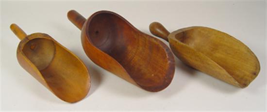 Appraisal: Three Turned Wooden Scoops Circa Maple Smallest is joined with