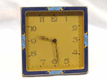 Appraisal: An Art Deco square strut clock with enamelled front circa