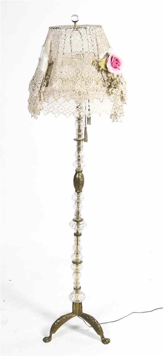 Appraisal: A Continental Brass and Glass Floor Lamp having a lace