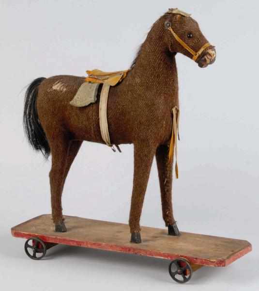 Appraisal: Early Horse on Platform Toy Description Unmarked but probably German