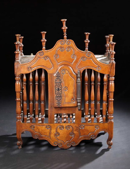 Appraisal: Provincial Louis XV-Style Fruitwood Pannetiere the shaped and domed top