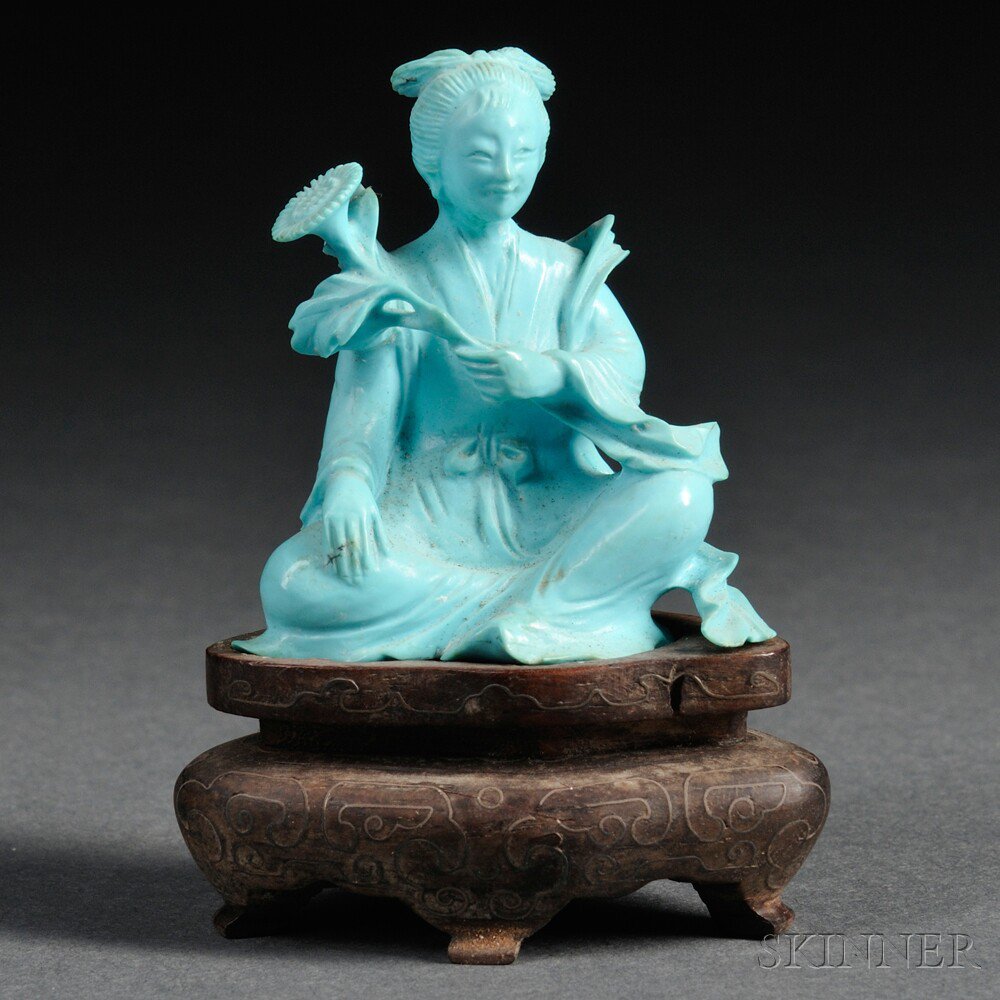 Appraisal: Turquoise Porcelain Figure China th century seated holding a flower