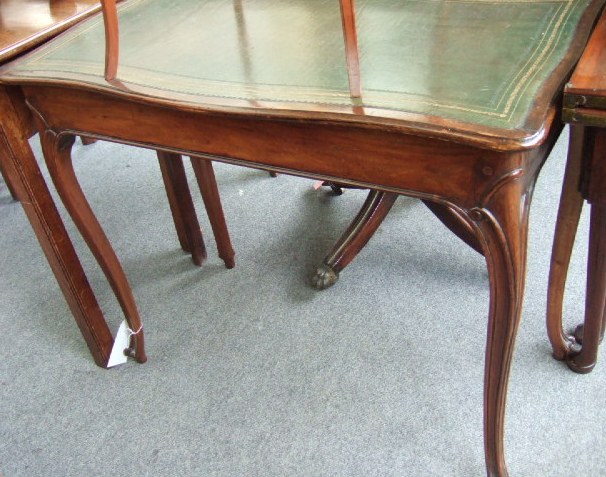 Appraisal: A th century mahogany centre table the shaped top inset