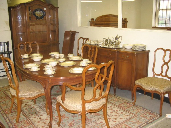 Appraisal: NINE-PIECE PROVINCIAL STYLE MAPLE DINING SET Drexel Furniture Co c