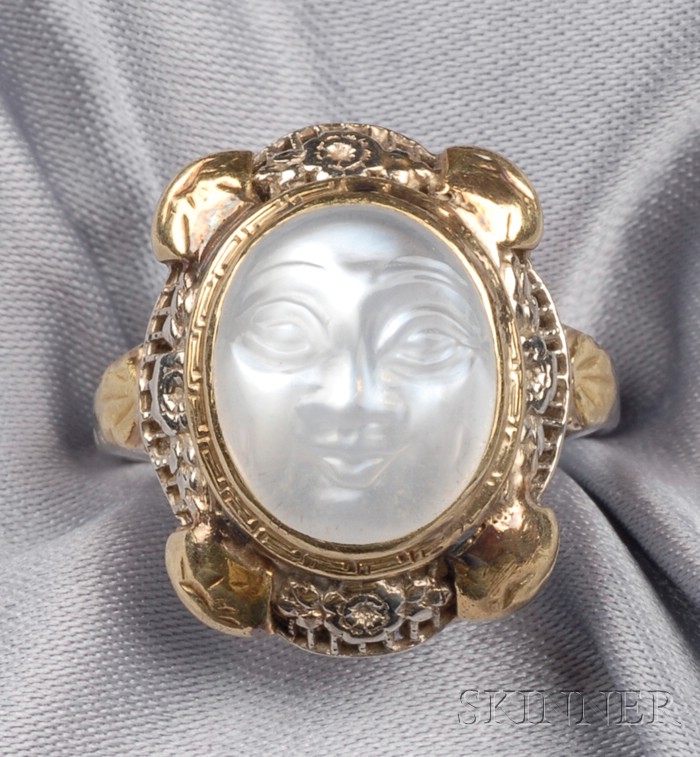 Appraisal: kt Bicolor Gold and Carved Moonstone Ring c s centering