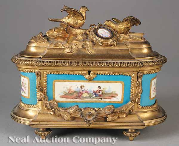 Appraisal: A Continental Gilt Bronze Coffer Mounted with Porcelain Plaques late