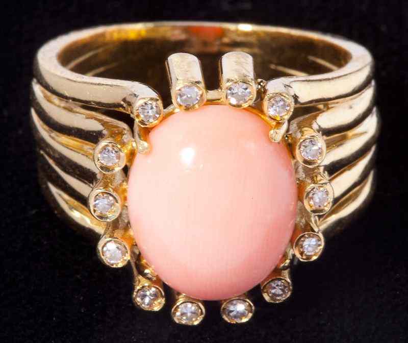 Appraisal: Angelskin Coral and Diamond Ringset in the center with an