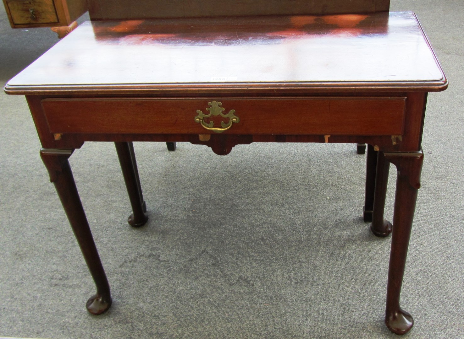 Appraisal: A made up th century mahogany single drawer side table