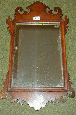 Appraisal: A thC walnut framed pier glass with fretwork frame in