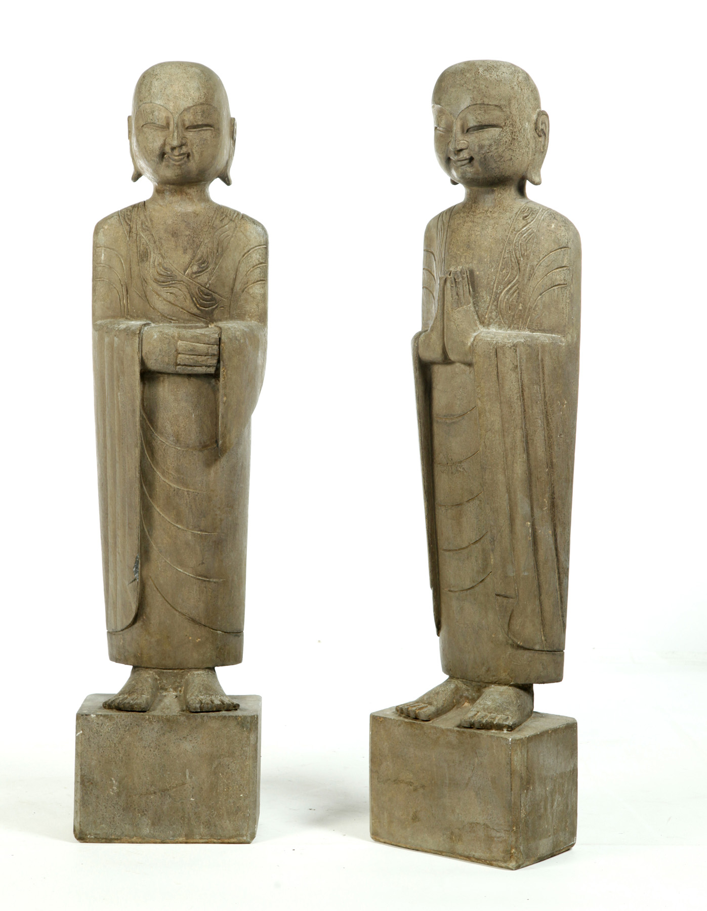 Appraisal: PAIR OF CHINESE STONE LOHAN FIGURES Twentieth century granite Robed