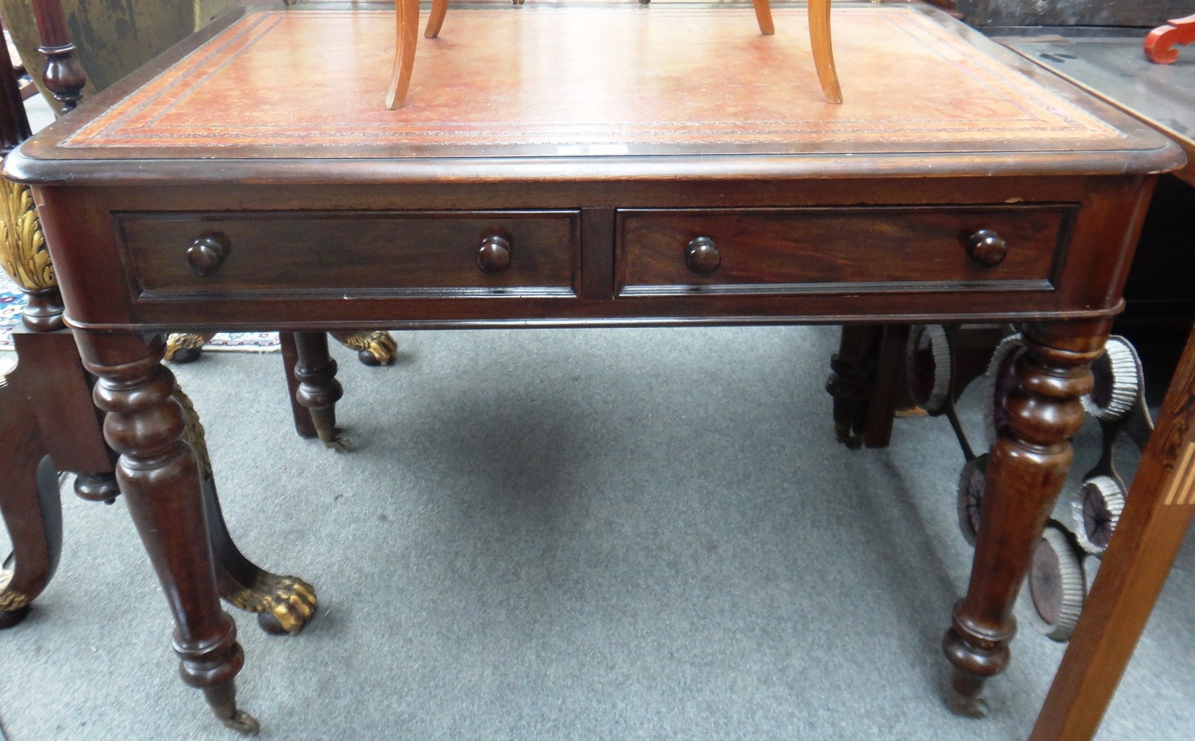 Appraisal: A Victorian mahogany library table with inset tooled leather top