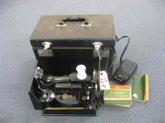 Appraisal: Singer Feather Weight Sewing Machine plus box with zig-zag attachments