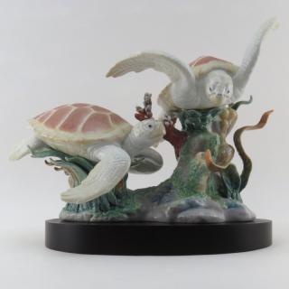 Appraisal: Lladro Sea Turtle Porcelain Grouping Includes wooden base and original