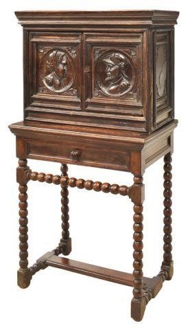 Appraisal: Spanish carved oak stepback cabinet on stand th c molded