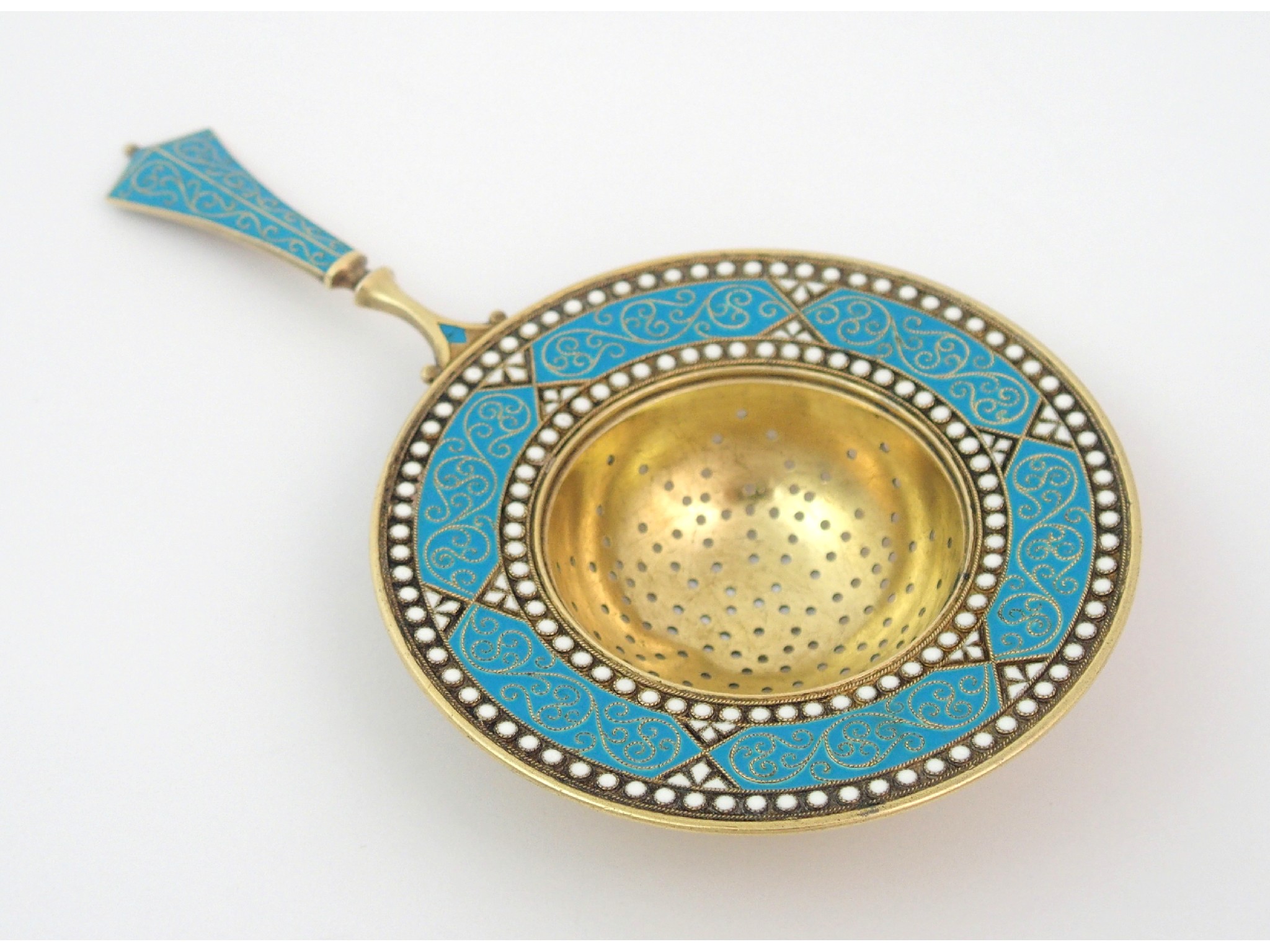 Appraisal: A Scandinavian silver gilt and enamel tea strainermarked the circular