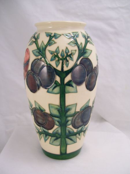 Appraisal: Moorcroft Pottery Vase White background with decorated plums and redbirds