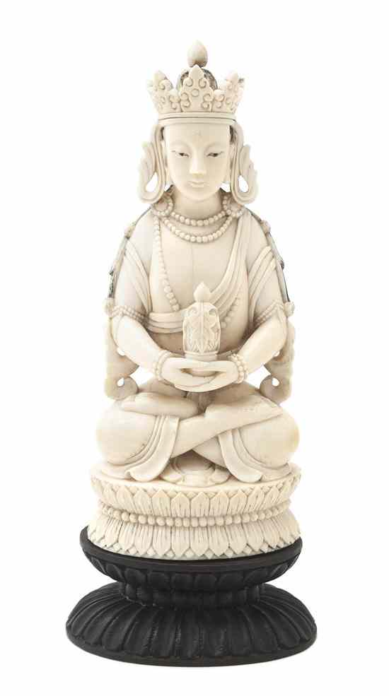 Appraisal: A Carved Ivory Figure of a Seated Buddha depicted in