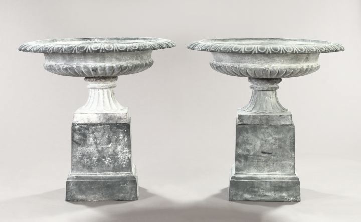 Appraisal: Large Pair of Neoclassical-Style Cast-Iron Garden Urns-on-Stands in three parts