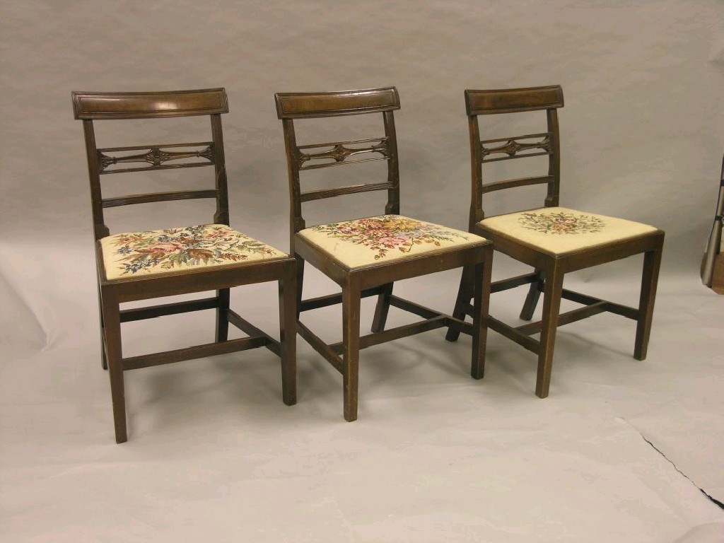 Appraisal: A set of eight Sheraton-style mahogany dining chairs over-hanging top