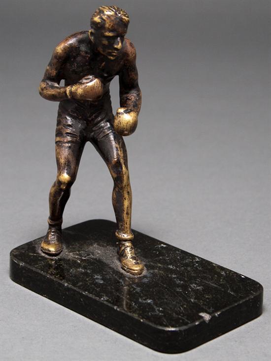 Appraisal: Patinated bronze boxing figure mounted on a black onyx base