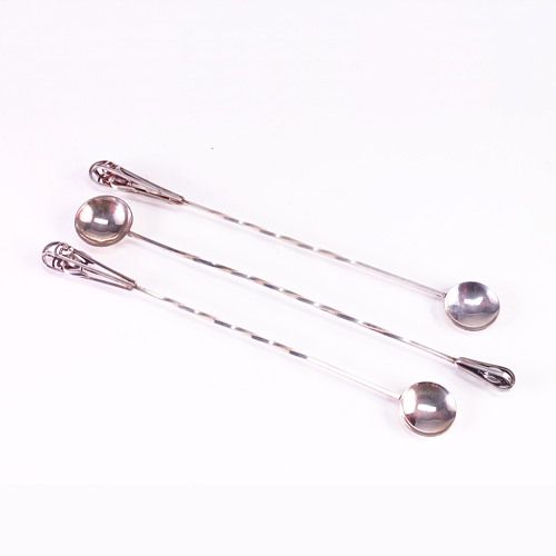 Appraisal: Three sterling cocktail stirrers one marked Georg Jensen one t