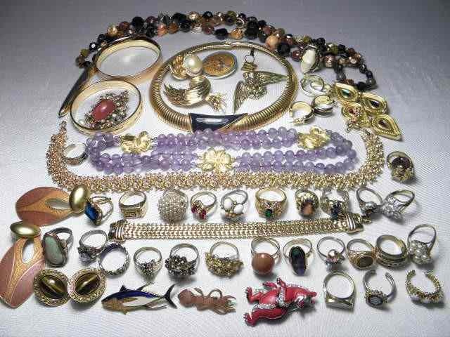 Appraisal: Tray lot of assorted costume jewelry including many Monet one