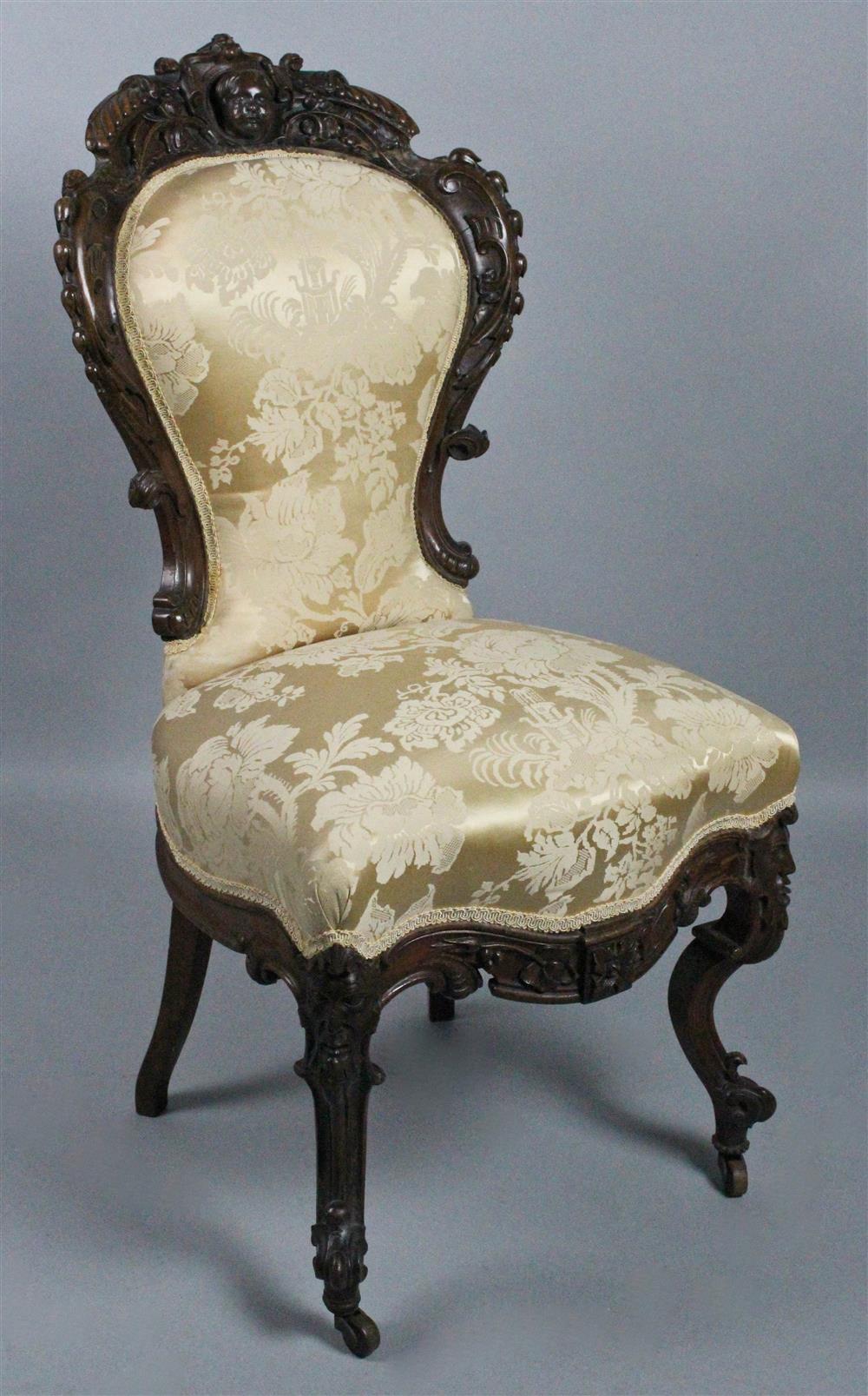 Appraisal: ROCOCO REVIVAL CARVED MAHOGANY CHAIR having a heavily carved frame