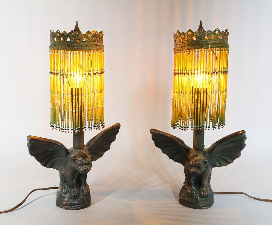 Appraisal: Pair of figural gargoyle or winged dog cast metal lamps