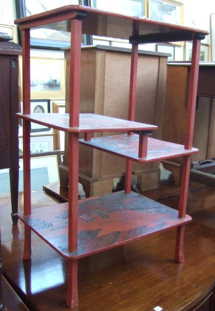 Appraisal: An early th century red lacquer and chinoiserie decorated etagere