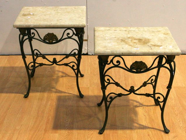 Appraisal: A pair of wrought iron and stone topped side tables