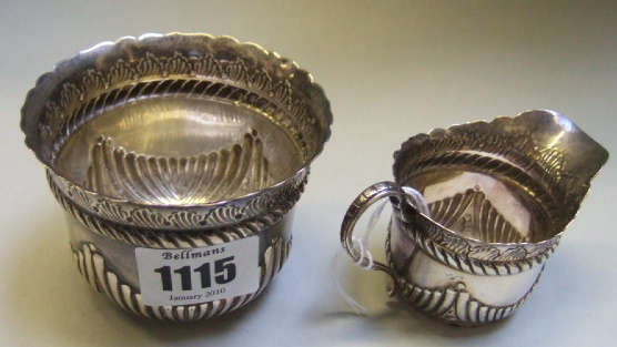 Appraisal: A Victorian silver sugar bowl and a matching cream jug