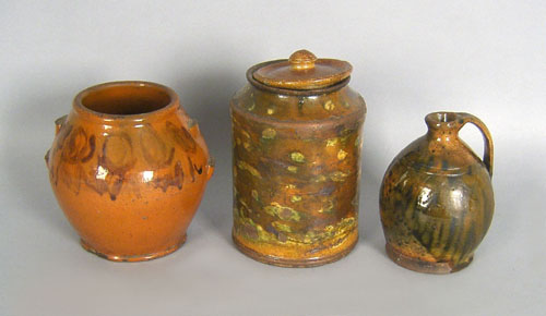 Appraisal: Two redware crocks h h together with a jug th