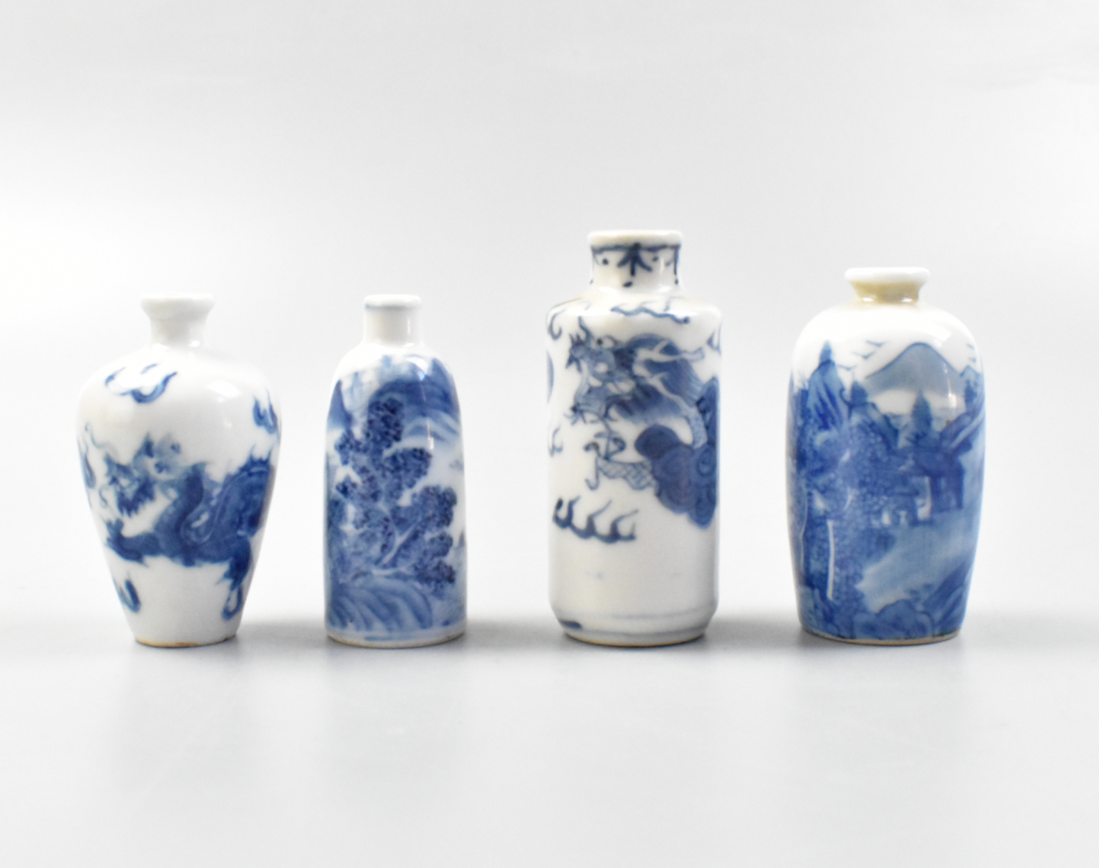 Appraisal: A group of four Chinese blue and white snuff bottles