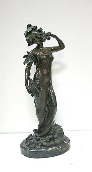 Appraisal: A patinated bronze figure of a woman Phalene Lucien Charles