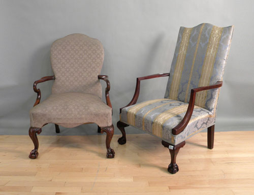 Appraisal: Two Chippendale style mahogany lolling chairs