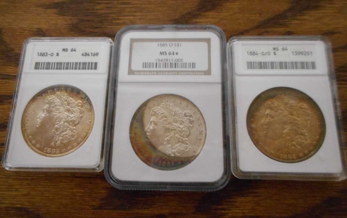 Appraisal: THREE U S SILVER MORGAN DOLLARS -O ANACS graded MS-