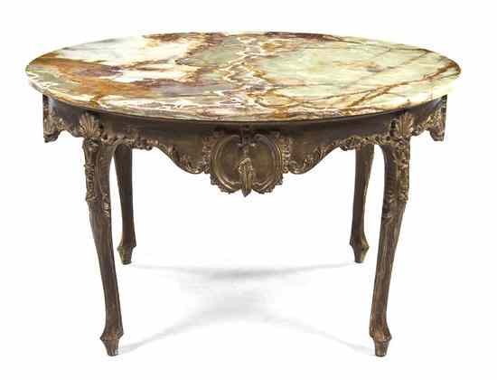 Appraisal: A Continental Carved Low Table having a circular onyx top