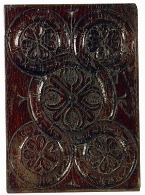 Appraisal: A late th century carved oak panel with five florets