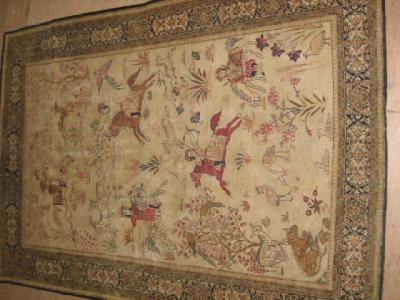 Appraisal: A PERSIAN PICTORIAL RUG the ivory field depicting mounted hunters