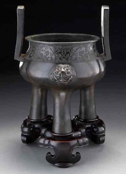 Appraisal: Chinese Ming-Qing bronze tripod censerdepicting the face of the beast