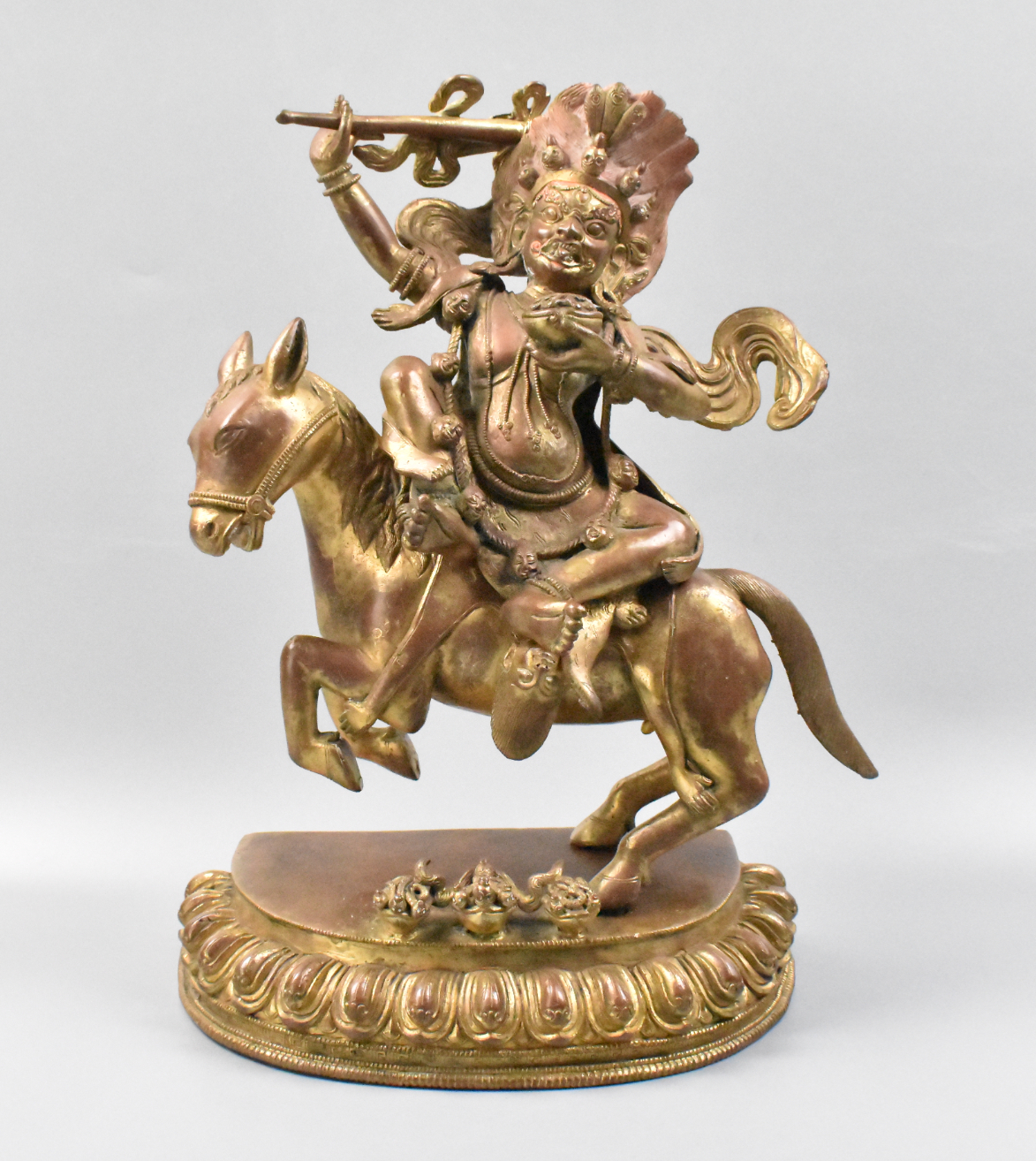 Appraisal: A Tibetan Nepal gilt bronze guardian figure th C riding